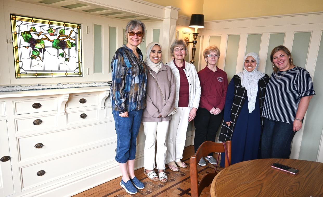 Board members from The Coldwater Community Center, Lisa Renshaw, Jummeloh Moshen, Kathie Bappert, Margaret Fillmore, Salwa Alsuraimi, and Courtney Dirschell, show off the restored dining room of the Beech House.