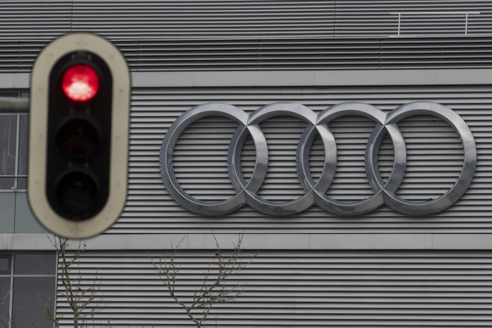 FILE -- In this Wednesday, March 15, 2017 photo a traffic sign shows a red light in front of the Audi headquarters in Ingolstadt, Germany. Audi accepted a fine of 800 million euro (927 million US$) for it's involvement in the Diesel scandal. (Armin Weigel/dpa via AP, file)