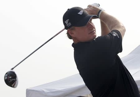 Golfer Ernie Els of South Africa watches his tee shot as he inaugurates the Els Performance Golf Academy in Hung Yen province, near Hanoi October 20, 2015. REUTERS/Kham