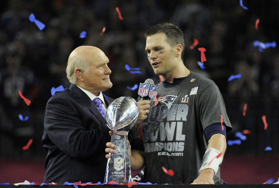 HOUSTON, TX - FEBRUARY 05: Tom Brady #12 of the New England Patriots with the Vince Lombardi trophy talks with Fox analyst Terry Bradshaw after the Patriots defeat the Atlanta Falcons 34-28 in overtime of Super Bowl 51 at NRG Stadium on February 5, 2017 in Houston, Texas. (Photo by Focus on Sport/Getty Images)
