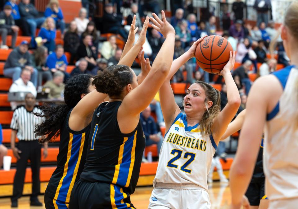 The Adrian Madison defense stops Ida's Jessica Schrader in the lane during a 49-22 Madison victory in the semifinals of the Division 2 District at Tecumseh on Wednesday, March 6, 2024.