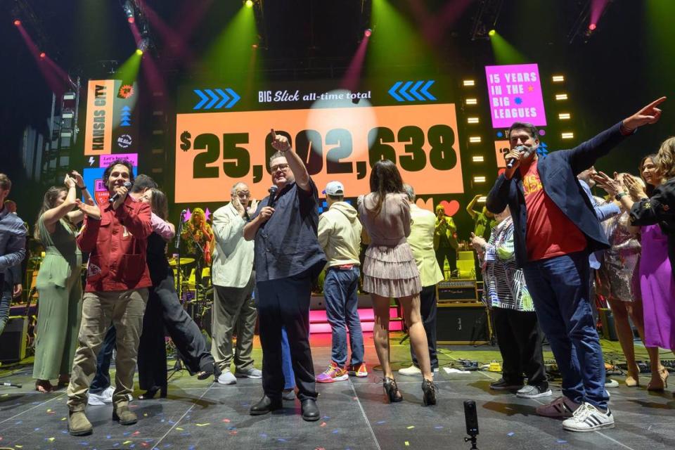 From left, Paul Rudd, Eric Stonestreet and Rob Riggle thank the crowd after announcing that since it started in 2010, Big Slick has raised over $25 million for Children’s Mercy. This year alone, the event raised almost $4 million, a record.