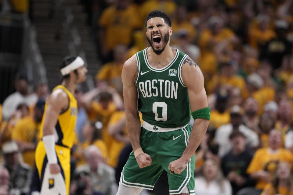 Boston Celtics forward Jayson Tatum (0) celebrates during the second half of Game 3 of the NBA Eastern Conference basketball finals against the Indiana Pacers, Saturday, May 25, 2024, in Indianapolis.  (AP Photo/Michael Conroy)