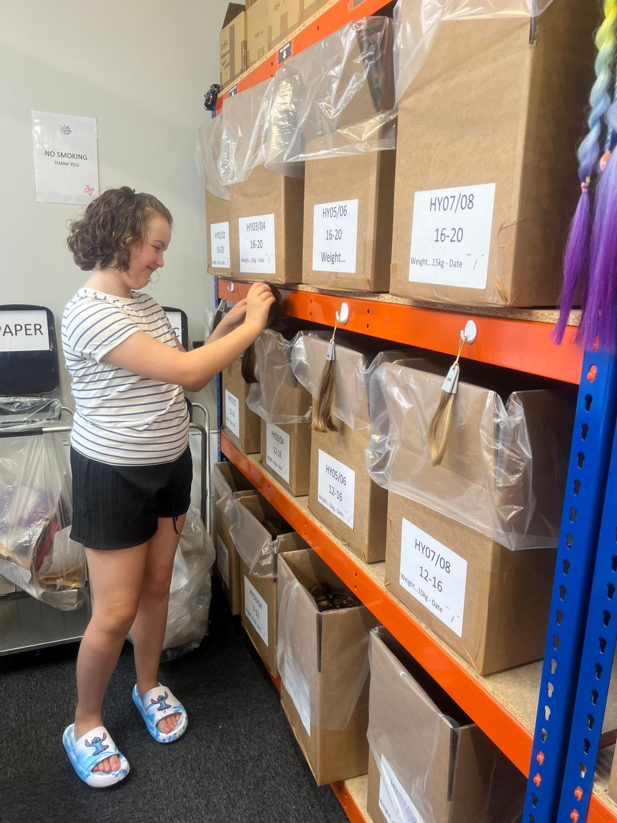 Girl looking in boxes 