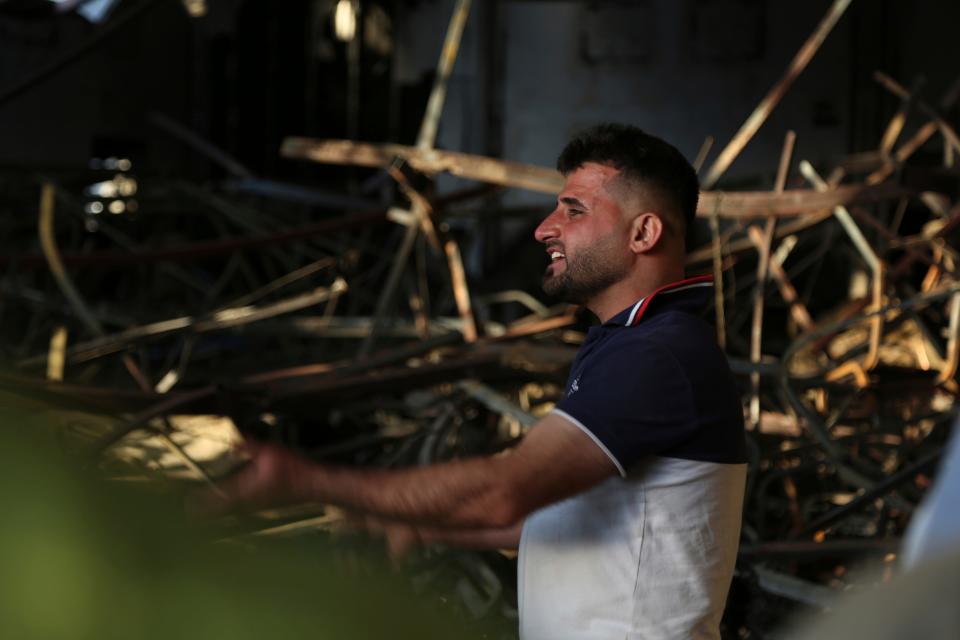 An Iraqi reacts at the site of a fatal fire in the district of Hamdaniya, Nineveh province, Iraq, Wednesday, Sept. 27, 2023. A fire that raced through a hall hosting a Christian wedding in northern Iraq killed multiple people, authorities said Wednesday.