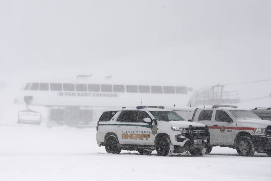 Placer County sheriff vehicles are parked near the ski lift at Palisades Tahoe where avalanche occurred on Wednesday, Jan. 10, 2024, in Tahoe, Calif. (AP Photo/Andy Barron)