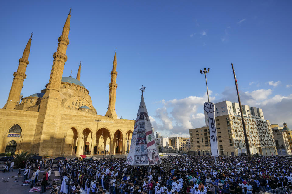 Muslim worshippers pray during Eid al-Fitr morning prayer outside the Mohammad al-Amin Mosque in downtown of Beirut, Lebanon, Friday, April 21, 2023. (AP Photo/Hassan Ammar)