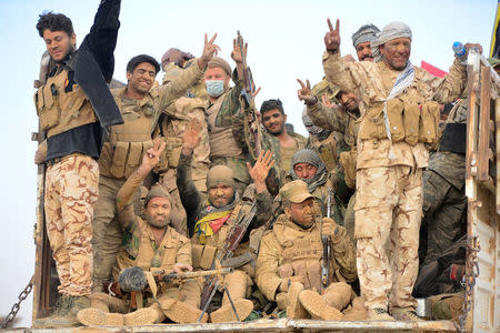 Popular Mobilization Forces (PMF) take part in an operation against Islamic State militants on the outskirts of the town of Hammam Al-Alil, south of Mosul, Iraq October 31, 2016. REUTERS/Stringer