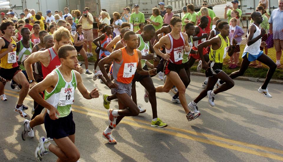 Elite runners spring from the starting line of the 30th Annual Utica Boilermaker 15k Road Race on Culver Avenue, Sunday, July 8, 2007.