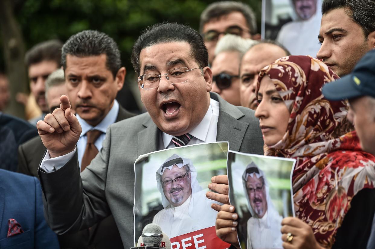 Egyptian opposition politican Ayman Nour (L), flanked by Nobel Peace Prize laureate Yemeni Tawakkol Karman (R), speaks during a press conference as they hold pictures of missing journalist Jamal Khashoggi during a demonstration in front of the Saudi Arabian consulate on October 8, 2018 in Istanbul. (Ozan Kose/AFP via Getty Images)