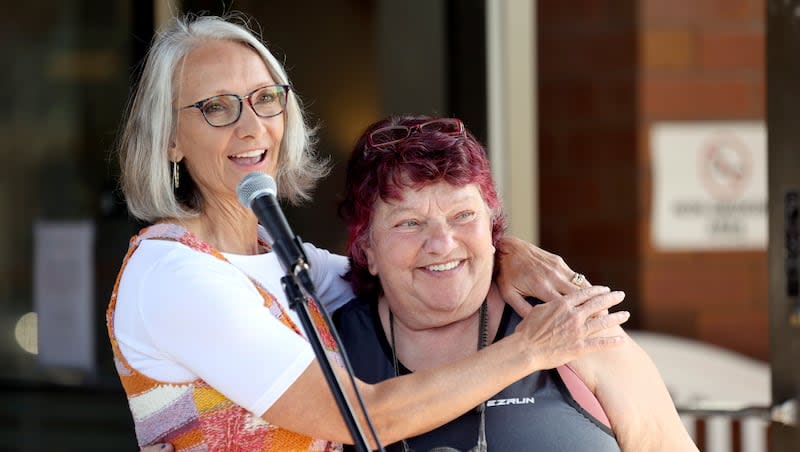 Carol Hollowell, Switchpoint Community Resource Center executive director, hugs Petie Hale, who was formerly homeless and currently lives at The Point Airport, during a ribbon-cutting ceremony for The Point Fairpark by Switchpoint, a deeply affordable housing project that will provide housing to 100 formerly homeless individuals, in Salt Lake City on Tuesday, May 16, 2023. The Point Fairpark will have secure entrances, ADA-compliant units and on-site support services for veterans and seniors.