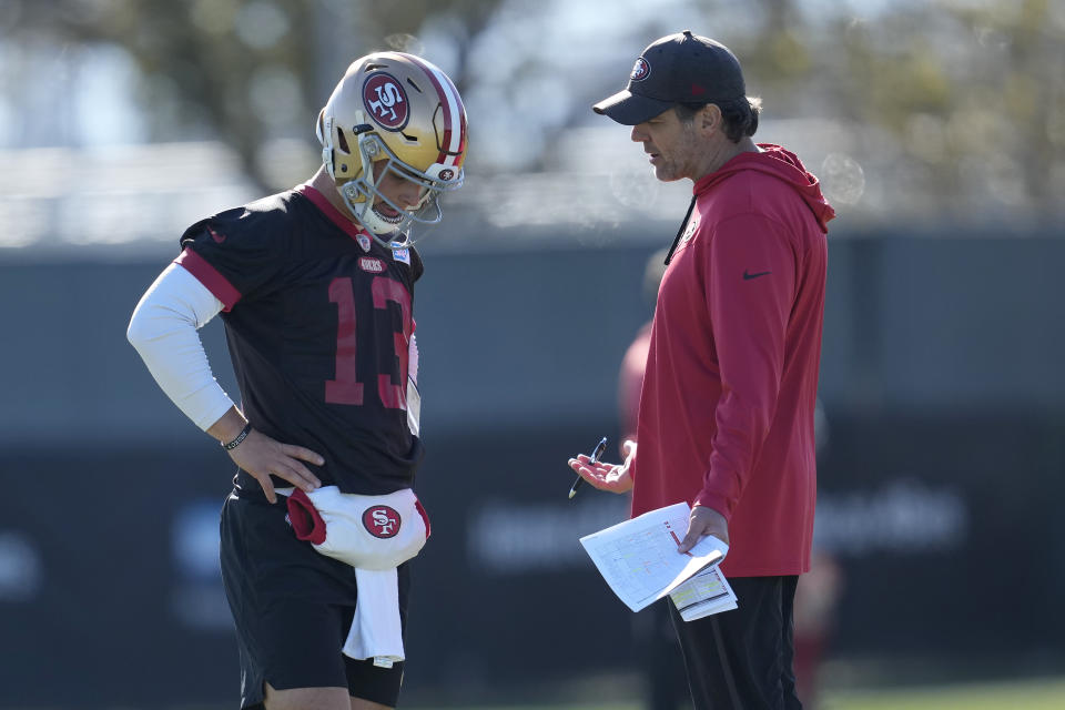 San Francisco 49ers quarterback Brock Purdy (13) talks with quarterbacks coach Brian Griese during an NFL football practice in Santa Clara, Calif., Thursday, Jan. 26, 2023. The 49ers are scheduled to play the Philadelphia Eagles Sunday in the NFC championship game. (AP Photo/Jeff Chiu)