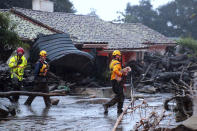 <p>A small dog is rescued on Olive Mill Rd. Tuesday, Jan. 9, 2018, in Montecito, Calif. (Photo: Stacey Wright/Santa Barbara Urban Hikers via AP) </p>