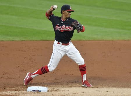 Sep 14, 2017; Cleveland, OH, USA; Cleveland Indians shortstop Francisco Lindor (12) turns a double play in the second inning against the Kansas City Royals at Progressive Field. Mandatory Credit: David Richard-USA TODAY Sports