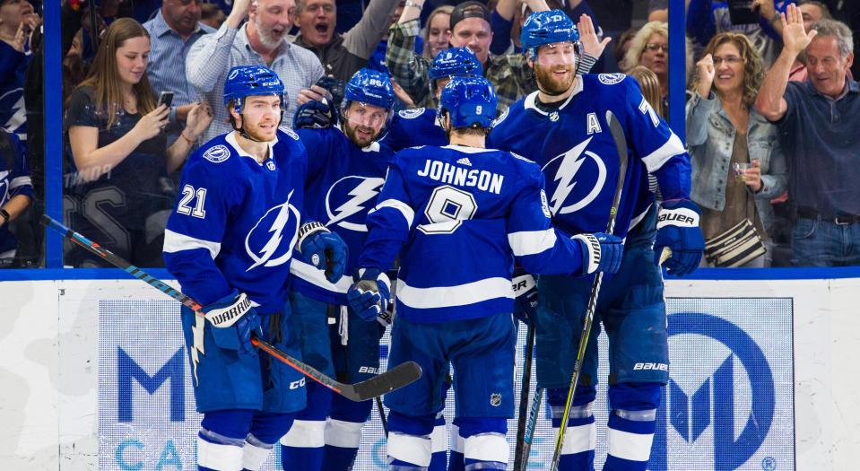 Nikita Kucherov celebrates with teammates after scoring the goal that proved to be his 100th point of the 2018-19 campaign. (Photo by Casey Brooke Lawson/NHLI via Getty Images)