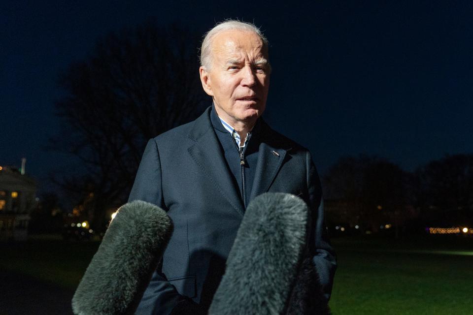 President Joe Biden answers a reporter's question as he walks from Marine One upon arrival on the South Lawn of the White House, Dec. 20, 2023, in Washington.