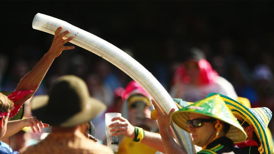 Spectators build a beer snake during day one of the Fourth Test match between Australia and India at the SCG.