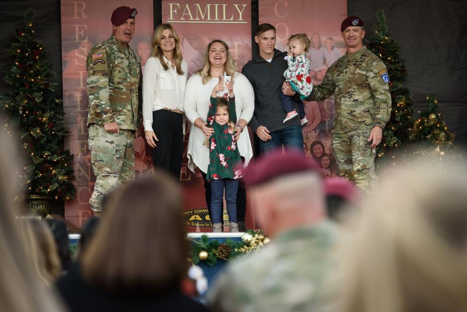 Capt. Sam Vona, his wife, Kristen, and their two daughters, Presley and Kathryn are named the Fort Bragg Family of the Year at the Fort Bragg Family of the Year and Tree Lighting ceremony on Friday, Dec. 3, 2021.
