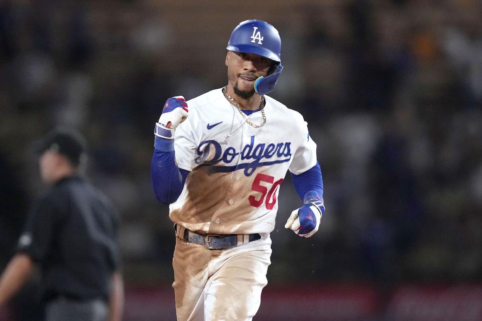 Los Angeles Dodgers second baseman Mookie Betts (50) celebrates after hitting a home run in the sixth inning Arizona Diamondbacks at Dodger Stadium in Los Angeles on Aug. 29, 2023.
