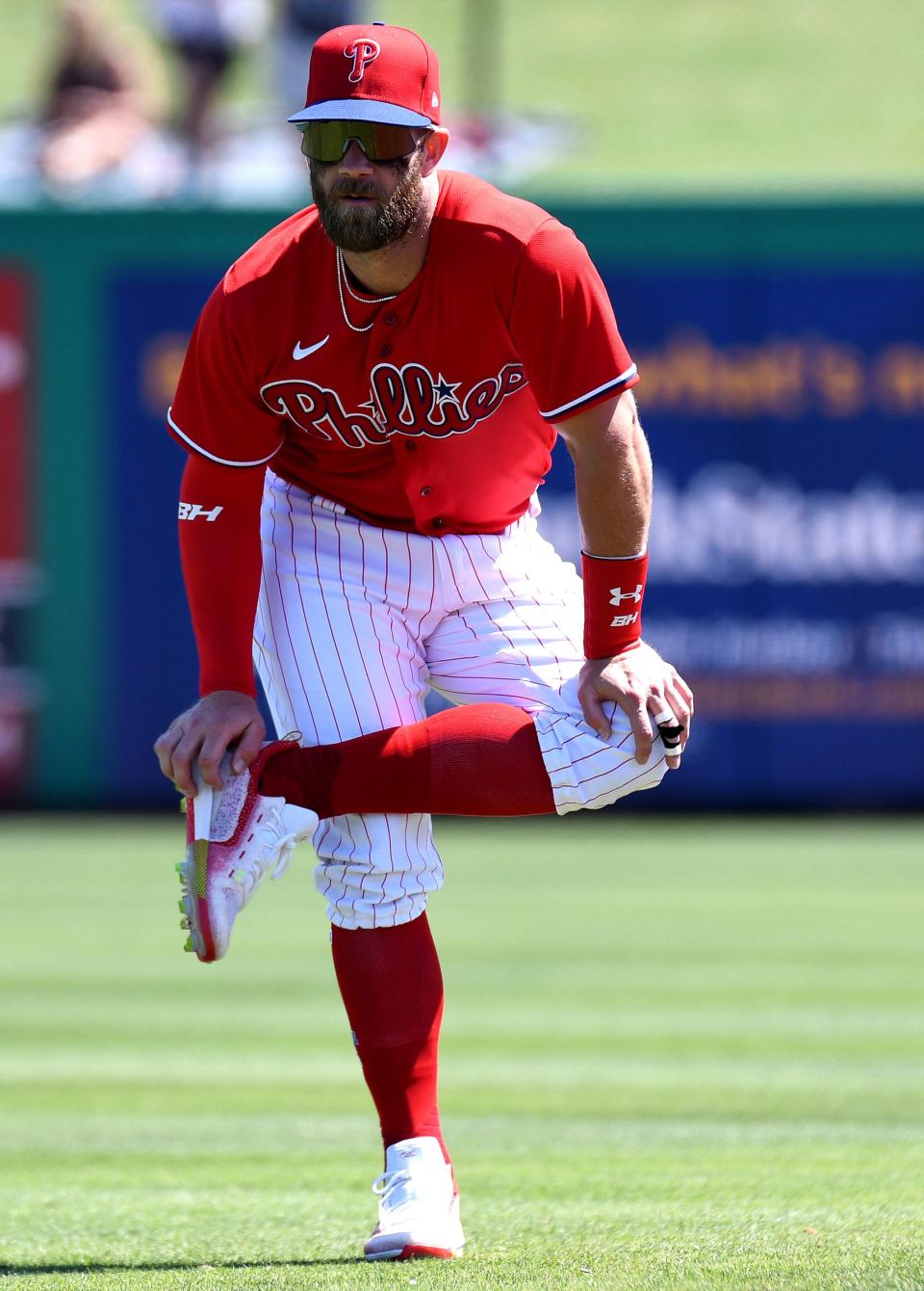 Phillies right fielder Bryce Harper warms up before the start of the exhibition game against the Tigers on Tuesday, March 22, 2022, in Clearwater, Florida.