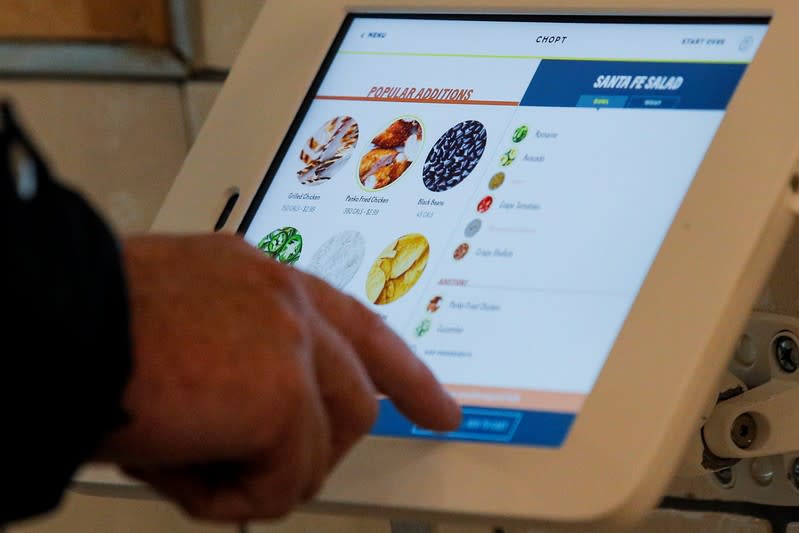 A customer places an order at the newest Chopt Creative Salad Co., location in New York