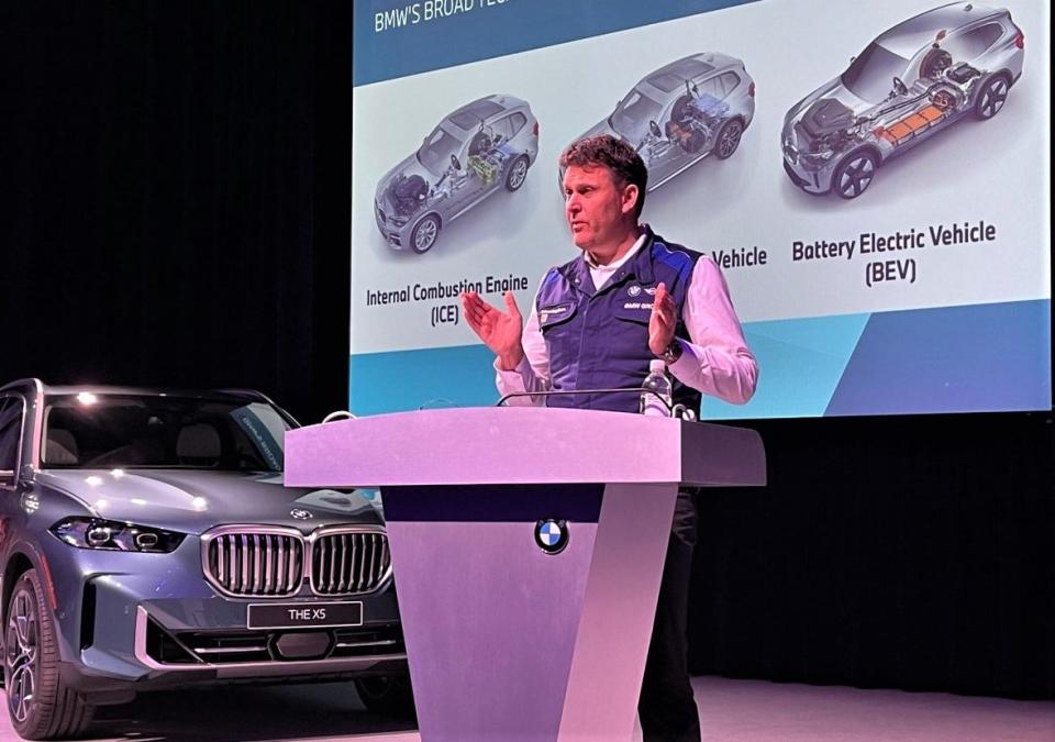 BMW Manufacturing President and CEO Robert Engelhorn addresses business leaders, Tuesday.