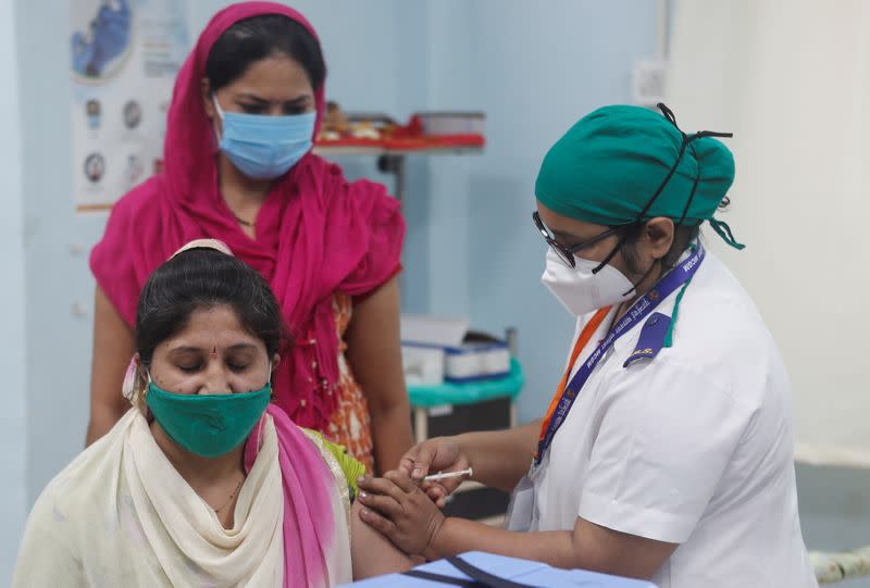 Healthcare worker receives AstraZeneca's COVISHIELD vaccine during the COVID-19 vaccination campaign at a medical centre in Mumbai