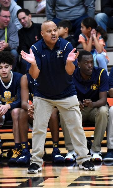 Walnut Hills Coach Ricardo Hill encourages his Eagles from the sidelines