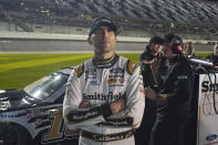 Aric Almirola watches the leader board as he stands on pit road during qualifying for the NASCAR Daytona 500 auto race at Daytona International Speedway, Wednesday, Feb. 15, 2023, in Daytona Beach, Fla. (AP Photo/John Raoux)