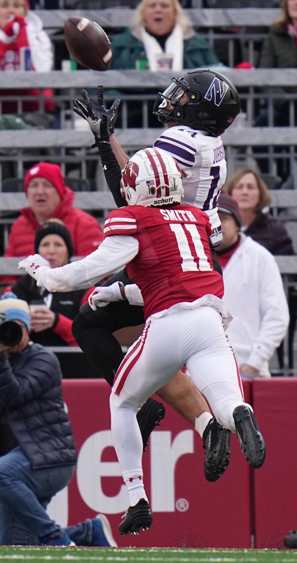 Northwestern wide receiver Cam Johnson catches a touchdown pass against Wisconsin cornerback Alexander Smith during the second quarter of their game Saturday.