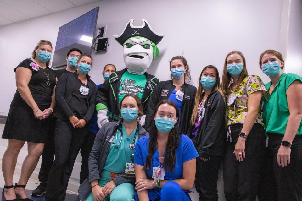 Davy poses with staff members of Memorial Hospital on Aug. 17, 2022. Davy walked through multiple pediatric wings of the hospital to meet children.