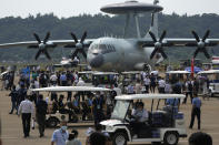 Visitors look at the Chinese military's KJ-500 airborne early warning and control aircraft during 13th China International Aviation and Aerospace Exhibition, also known as Airshow China 2021, on Wednesday, Sept. 29, 2021, in Zhuhai in southern China's Guangdong province. With record numbers of military flights near Taiwan over the last week, China has been stepping up its harassment of the island it claims as its own, showing an new intensity and sophistication as it asserts its territorial claims in the region. (AP Photo/Ng Han Guan)