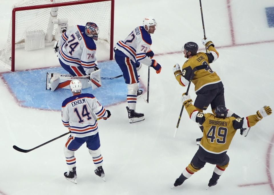 Vegas Golden Knights center Jack Eichel (9) celebrates after scoring against Edmonton Oilers goaltender Stuart Skinner (74) during the first period of Game 5 of an NHL hockey Stanley Cup second-round playoff series Friday, May 12, 2023, in Las Vegas. (AP Photo/John Locher)