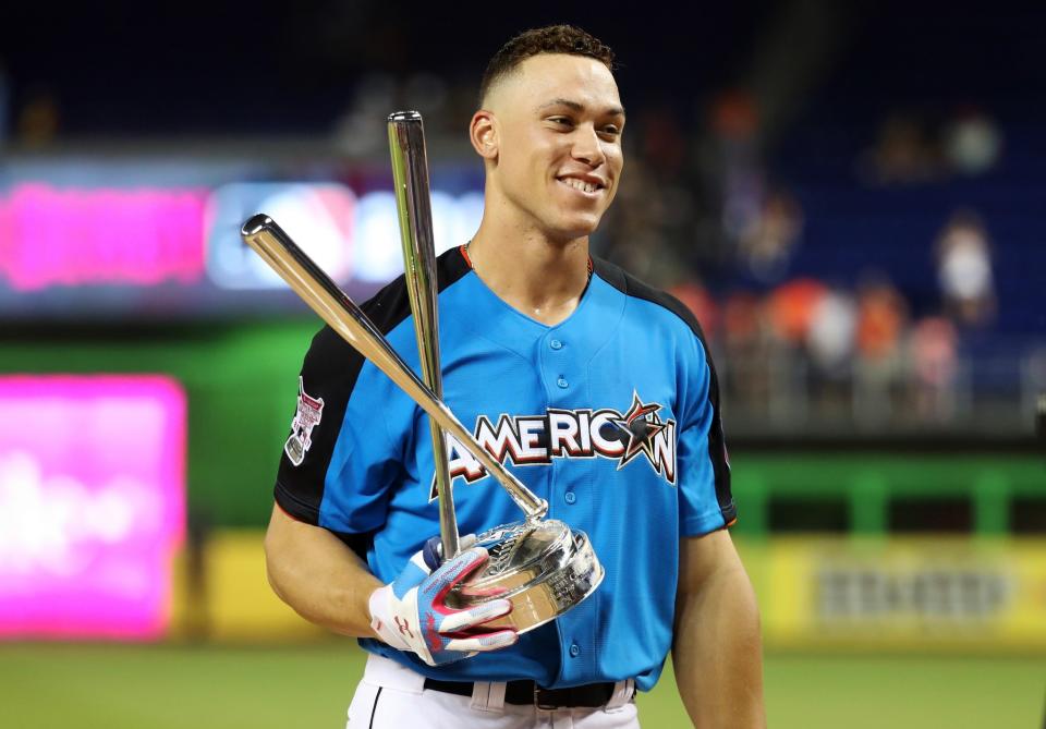 Aaron Judge #99 of the New York Yankees celebrates with the trophy after winning the T-Mobile Home Run Derby at Marlins Park on July 10, 2017 in Miami, Florida.