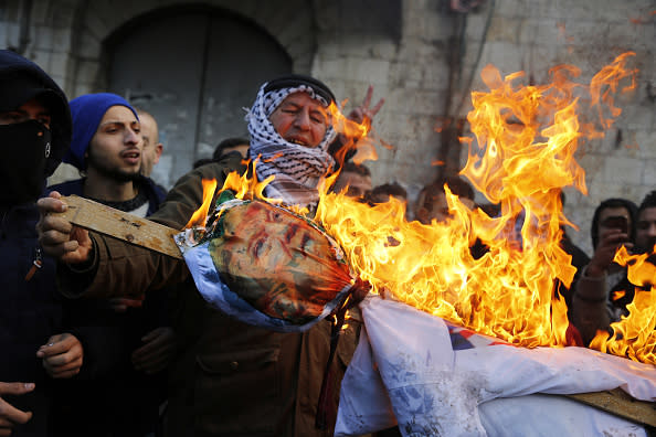 Palestinian protestors burn an effigy of President Donald Trump following his decision to recognize Jerusalem as the capital of Israel, in the West Bank city of Nablus, on December 7, 2017. (JAAFAR ASHTIYEH/AFP/Getty Images)