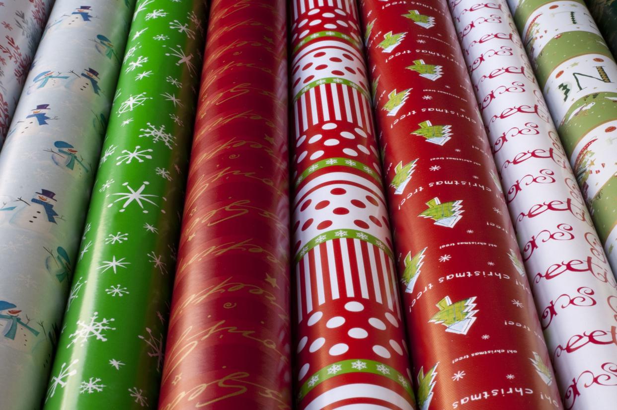 Rows of Christmas gift wrap paper:  More Christmas: