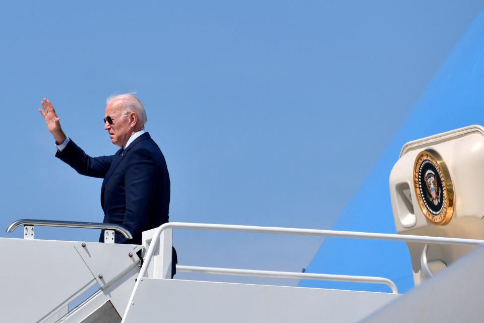 US President Joe Biden waves as he boards Air Force One at Cleveland Hopkins International Airport in Cleveland, Ohio, on May 27, 2021. (Photo by Nicholas Kamm / AFP) (Photo by NICHOLAS KAMM/AFP via Getty Images)