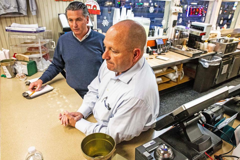 Chris Taggart and Brian Kirwin, co-owners of the landmark restaurant The Dog House, are featured behind the counter of the eatery in New Castle, Thursday, Dec. 7, 2023. The Dog House has been serving hot dogs since 1952 and under new ownership has a new breakfast menu.