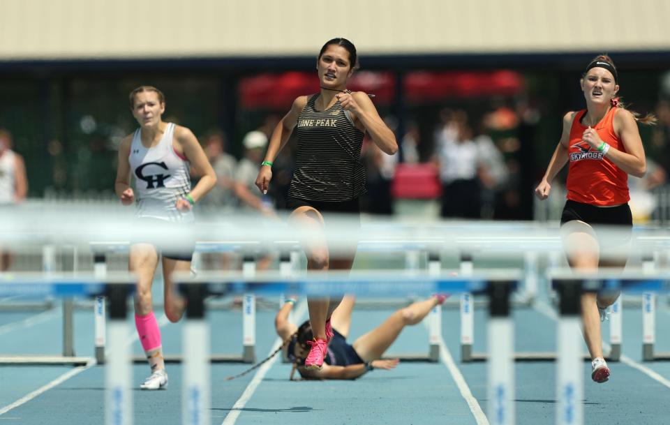 Lone Peak’s Nadia Chiara runs in and wins the 6A 300m hurdles as High School athletes gather at BYU in Provo to compete for the state track and field championships on Saturday, May 20, 2023. | Scott G Winterton, Deseret News