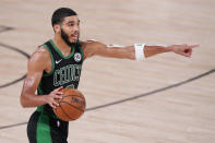 Boston Celtics' Jayson Tatum (0) directs a play during the second half of an NBA conference final playoff basketball game against the Miami Heat Friday, Sept. 25, 2020, in Lake Buena Vista, Fla. (AP Photo/Mark J. Terrill)