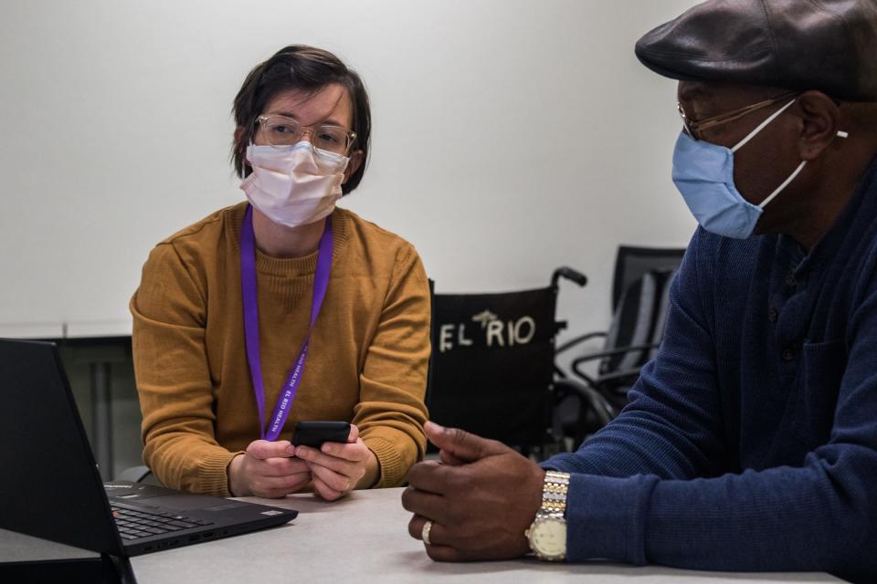 Advanced practice pharmacist Lisa Beckett asks her patient, David Grigsby, about his latest CGM data at a federally funded health clinic in Tucson on February 17, 2022.