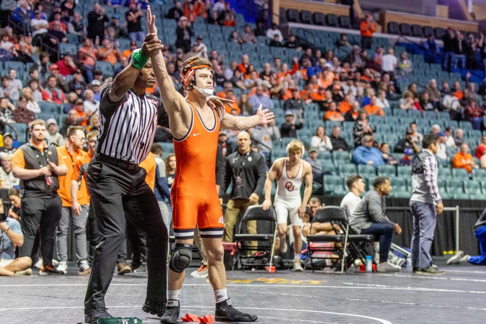 OSU wrestler Reece Witcraft celebrates after a win Sunday in the Big 12 Championships at BOK Center in Tulsa.