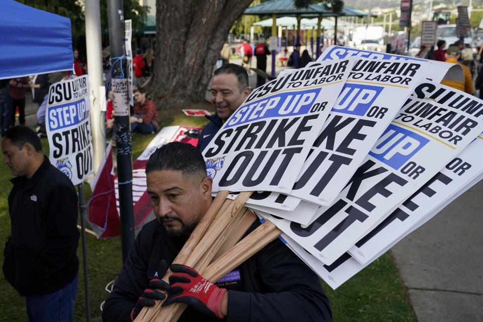 FILE - Members of the California Faculty Association rally and picket during a strike at San Francisco State University on Tuesday, Dec. 5, 2023, in San Francisco. Faculty at California State University, the largest public university system in the U.S., could stage a systemwide strike later this month after school officials ended contract negotiations Tuesday, Jan. 9, 2024, with a unilateral offer of a 5% pay raise, far below what the union is demanding. (AP Photo/Godofredo A. Vásquez, File)