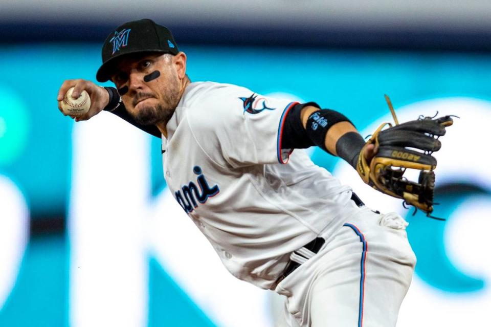 Miami Marlins short stop Miguel Rojas (11) throws to first base for the double play during the first inning of an MLB game against the Chicago Cubs at loanDepot park in the Little Havana neighborhood of Miami, Florida, on Tuesday, September 20, 2022.