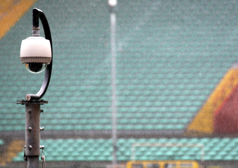 FILE - In this Feb. 6, 2007, file photo, a camera overlooking the stands is seen at Luigi Ferraris stadium in Genoa, Italy, during the unveiling to the press of the new security control room. Dave Karls has Bucks season tickets and is eager enough for his next visit to Fiserv Forum that having his location trackable in the arena would not interfere with the enjoyment. “I’d much rather have that than not be able to attend the game at all,” Karls said. Such concern depends on an individual's definition of surveillance, a word that carries nefarious connotation in some corners. (AP Photo/Italo Banchero, File)