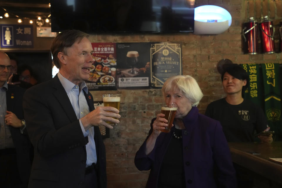 U.S. Treasury Secretary Janet Yellen, right, and U.S. Ambassador to China Nicholas Burns sample beer at the Jing-A brewery in Beijing, China, Monday, April 8, 2024. Treasury Secretary Yellen says the Biden administration will push China to change an industrial policy that poses a threat to U.S. jobs. (AP Photo/Tatan Syuflana, Pool)