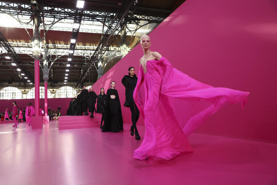 Models wear creations as part of the Valentino Ready To Wear Fall/Winter 2022-2023 fashion collection, unveiled during the Fashion Week in Paris, Sunday, March 6, 2022. (Photo by Vianney Le Caer/Invision/AP)