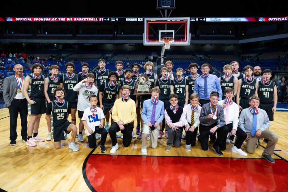 The Jayton boys basketball team poses with their hardware after defeating Benjamin 60-53 in the Class 1A state championship game on Saturday, March 9, 2024 at the Alamodome in San Antonio, Texas.