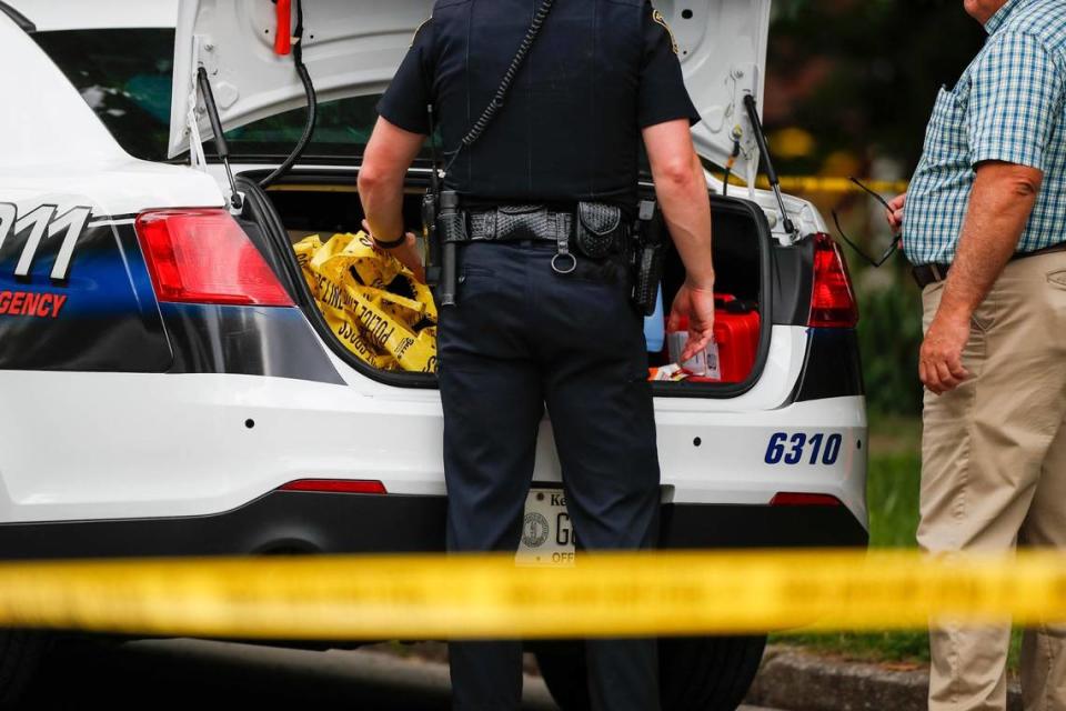 Police and Fayette County coroner on the scene of a triple homicide off of Caywwood and Alexandria Drive in Lexington, Ky., Wednesday, May 25, 2022.