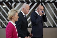President Joe Biden, center, walks with European Council President Charles Michel, right, and European Commission President Ursula von der Leyen during the United States-European Union Summit at the European Council in Brussels, Tuesday, June 15, 2021. (AP Photo/Patrick Semansky)